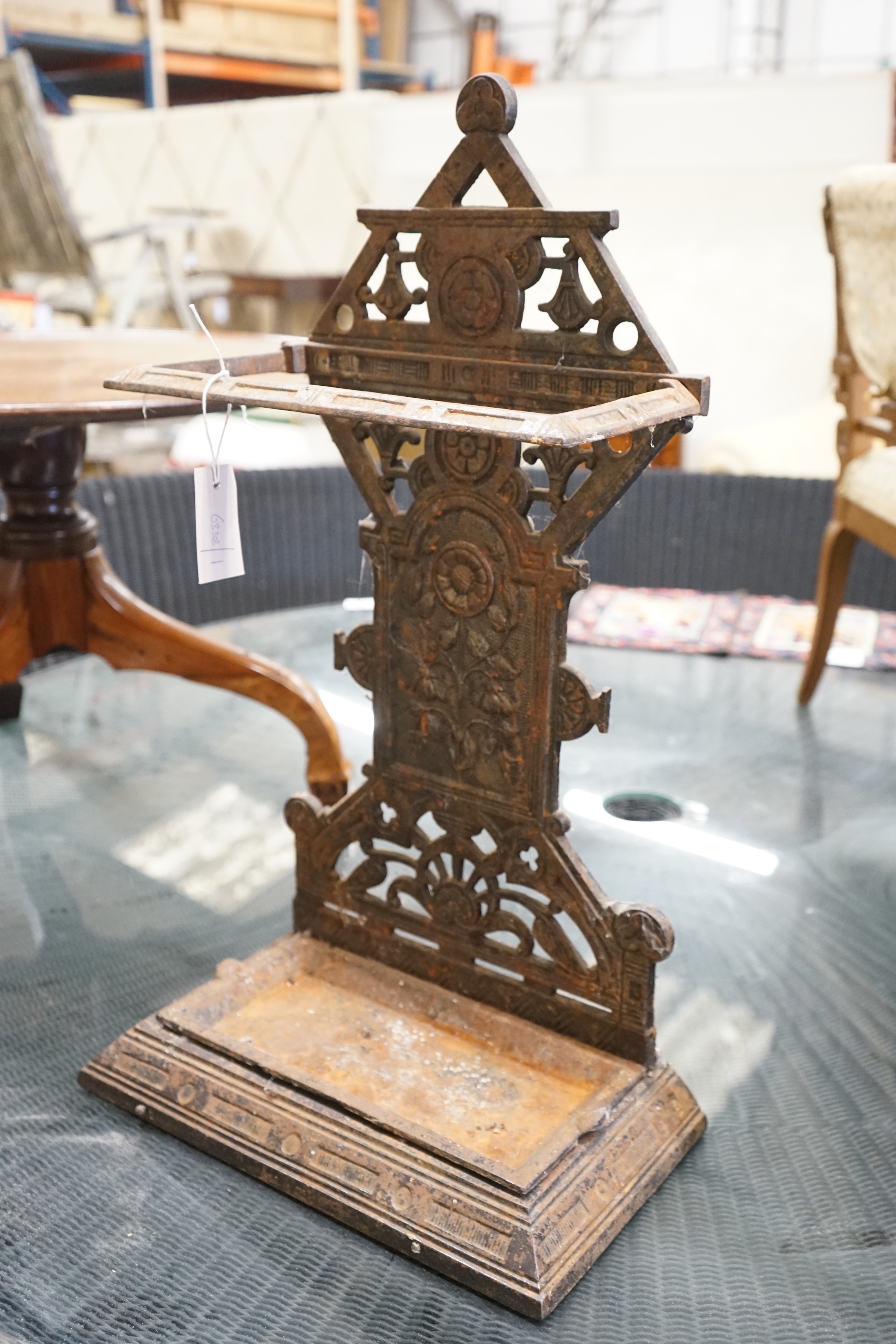 A late Victorian aesthetic movement cast-iron stickstand, width 40cm, depth 22cm, height 69cm